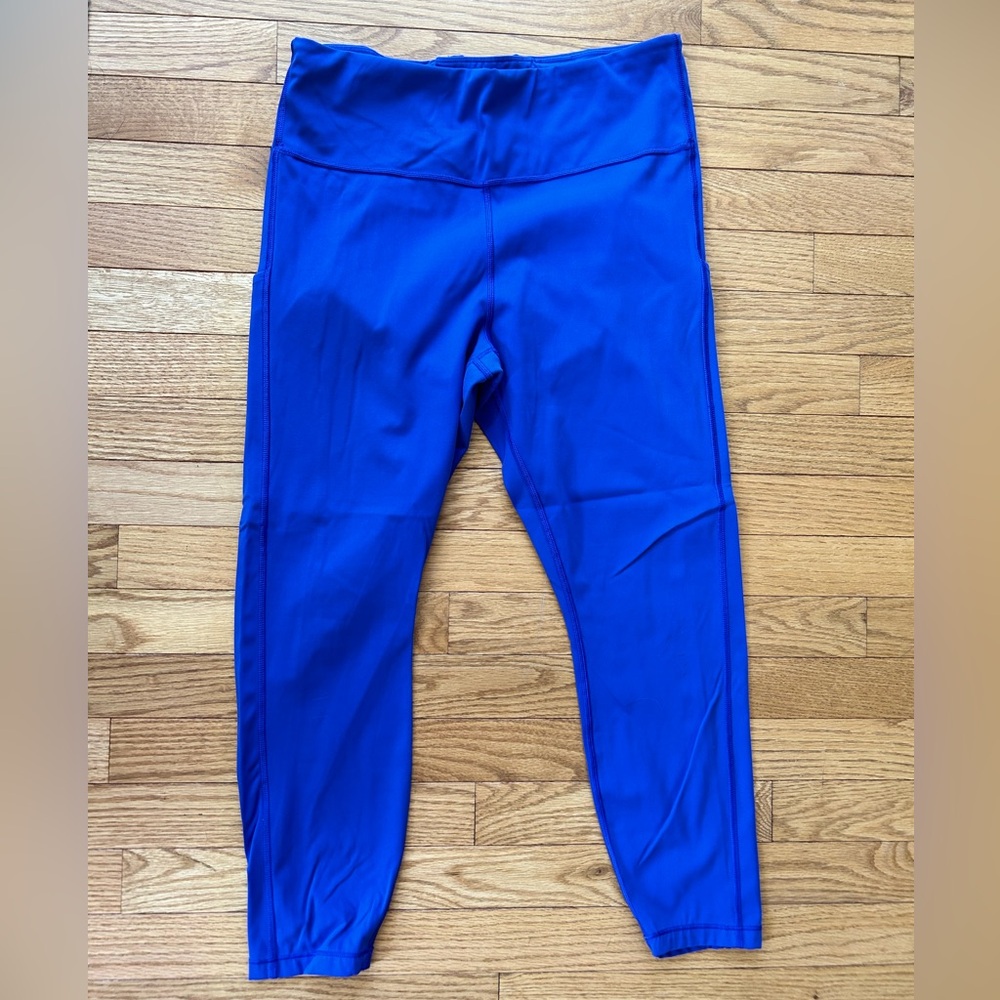 Athleta brand ultimate stash 7/8 leggings.  Royal blue. Size Lg